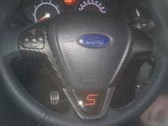 Carbon wrapped steering wheel